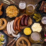 Oktoberfest dishes with beer, pretzel and sausage